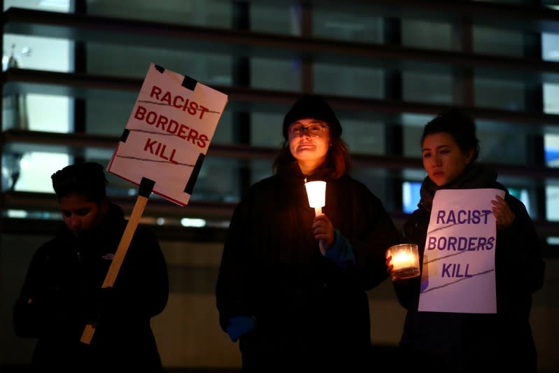 Anti-racism campaigners take part in a vigil, following the discovery of 39 bodies in a truck container, outside the Home Office in London