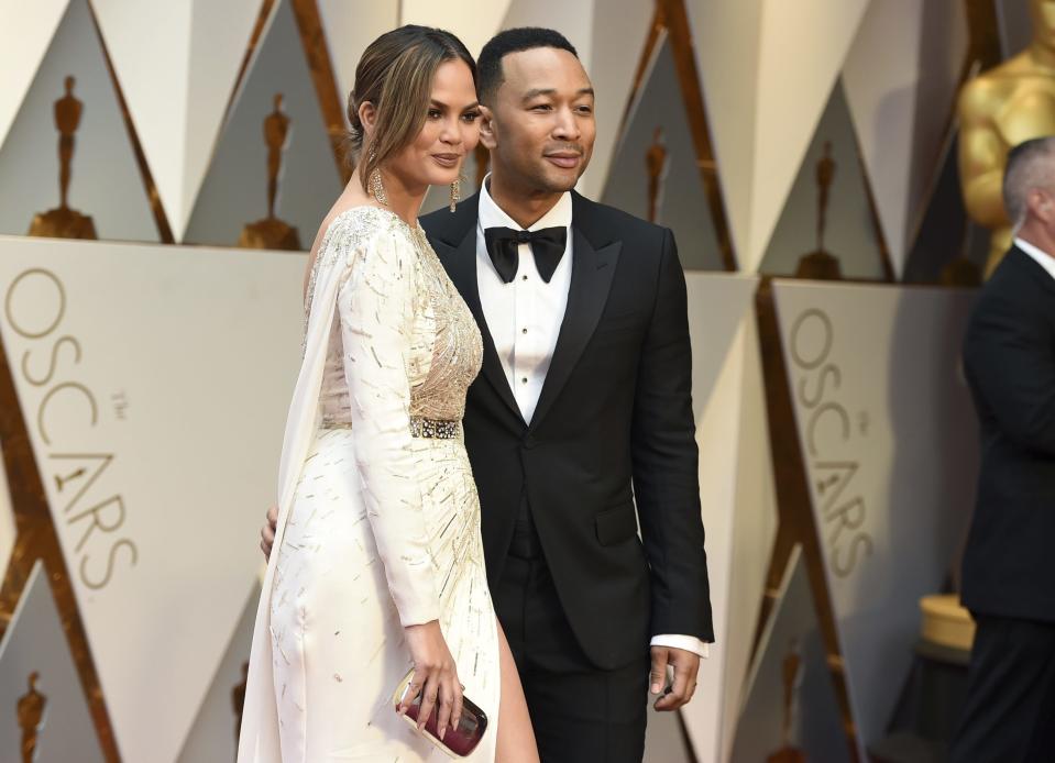 Chrissy Teigen, left, and John Legend at the Oscars in 2017. (Photo by Jordan Strauss/Invision/AP)