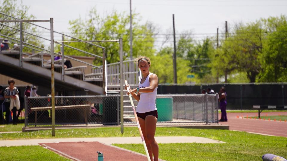 McMurry's Kelby Tidwell practices pole vaulting in practice.