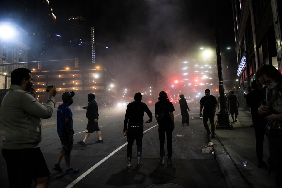 Protesters clash with police in Detroit early Saturday morning during a rally calling for an end to police violence and justice for George Floyd Friday, May 29, 2020. Floyd died earlier this week in police custody in Minneapolis.(Nicole Hester/Ann Arbor News via AP)/