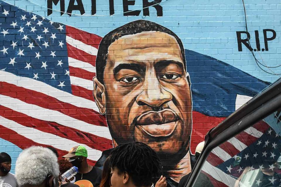 <p>Stephanie Keith/Getty</p> A mural of George Floyd in New York City on July 13, 2020