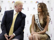 <p>Donald Trump and Miss Universe, Gabriela Isler of Venezuela, at a news conference on Oct. 2, 2014, in Doral, Fla. <i>(Photo: Wilfredo Lee/AP)</i> </p>