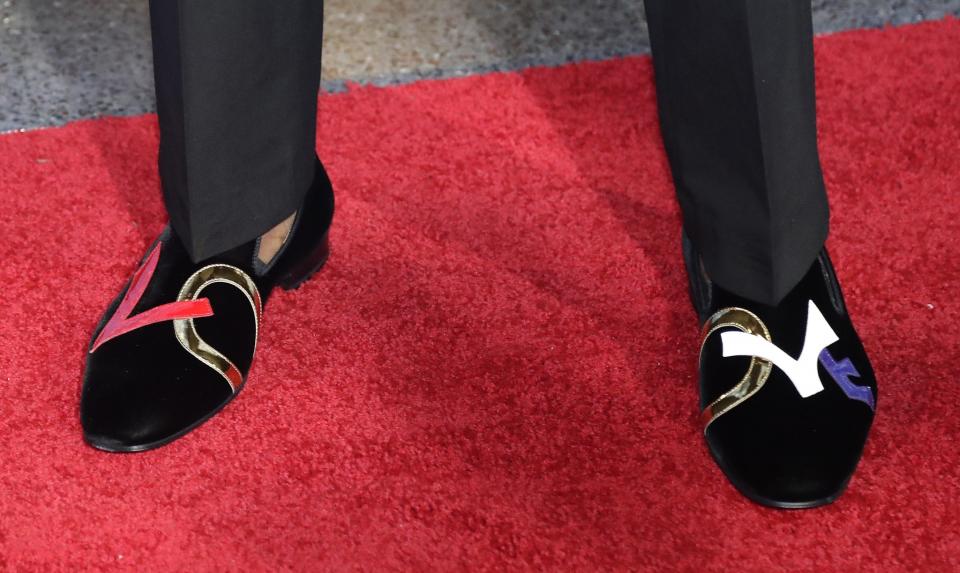 <p>Kentucky’s De’Aaron Fox shows off his shoes as he stops for photos while walking the red carpet before the start of the NBA basketball draft, Thursday, June 22, 2017, in New York. (AP Photo/Frank Franklin II) </p>