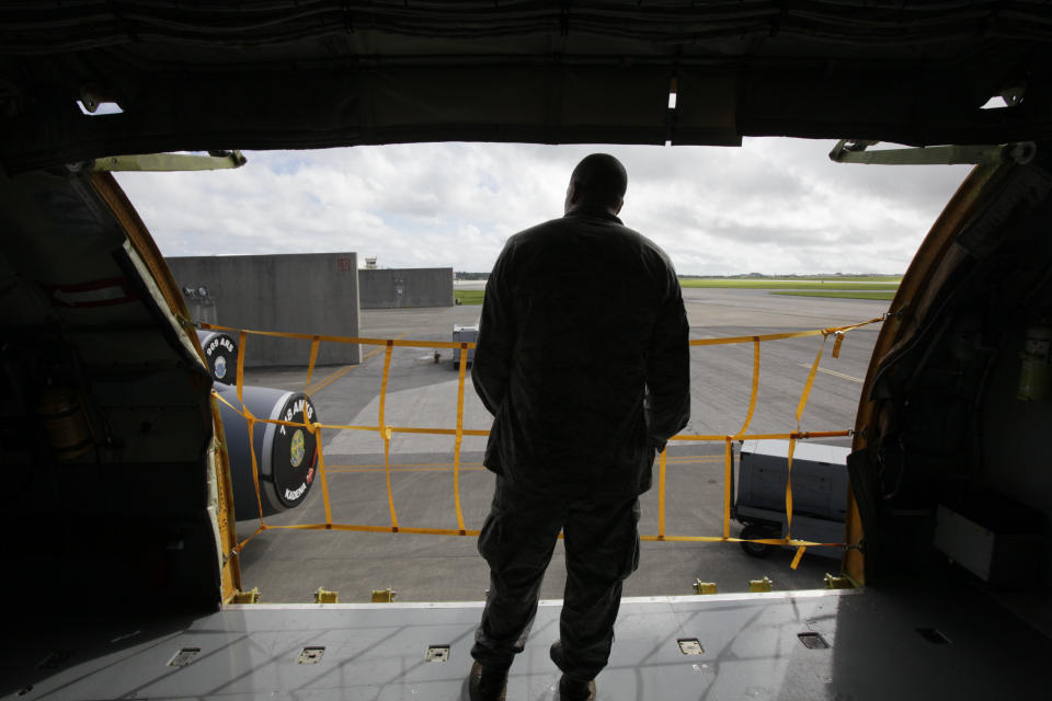 In this Aug. 14, 2012 photo, ground crew member Senior Airman George Snyder, of San Antonio, Texas, stands inside a U.S. Air Force KC-135 Stratotanker, which was built in 1958, at Kadena Air Base on Japan's southwestern island of Okinawa. For decades, the U.S. Air Force has grown accustomed to such superlatives as unrivaled and unbeatable. Now some of its key aircraft are being described with terms like decrepit. (AP Photo/Greg Baker)