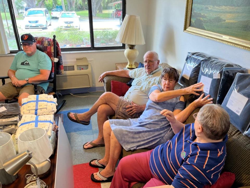 Residents inspect some of the materials being gathered for use in room upgrades at the 70-room VFW residential facility in Fort McCoy.