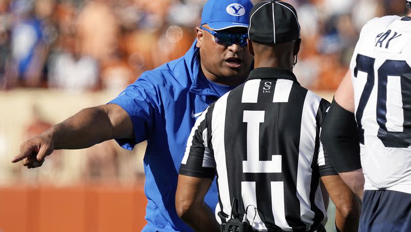 BYU coach Kalani Sitake, left, argues a call during a Big 12 game against Texas in Austin, Texas, on Saturday, Oct. 28, 2023. The Cougars hit the road again this week, with West Virginia next on the docket.