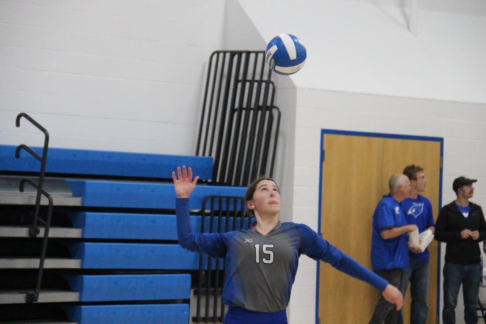 Perry's Charity Parnell serves the ball against West Marshall on Thursday, Sept. 22, 2022, in Perry.