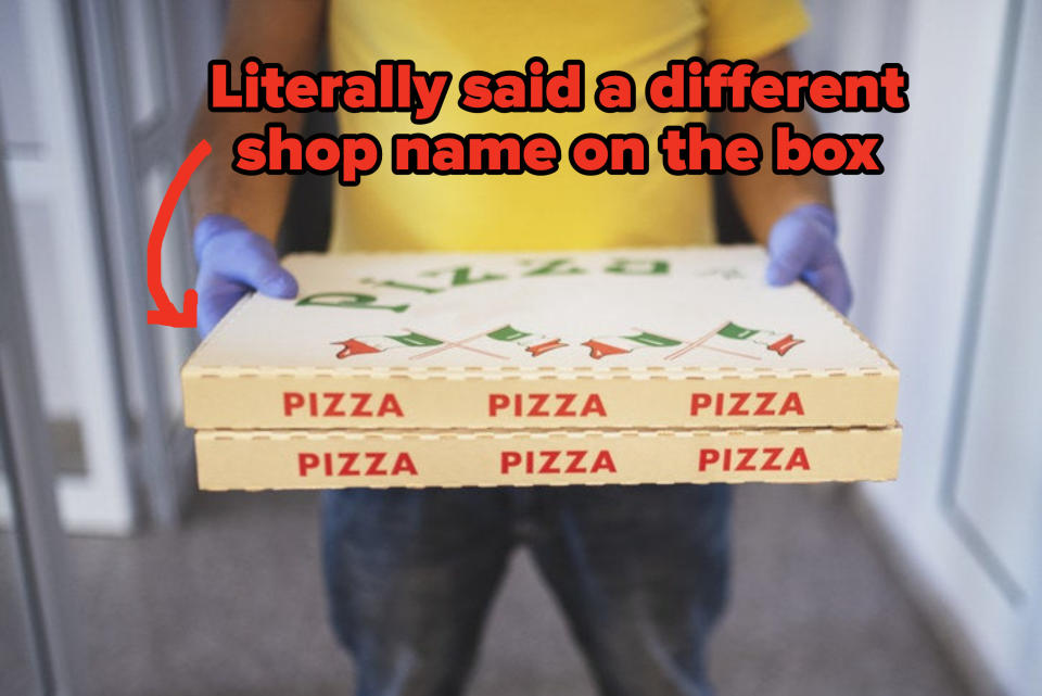 a man with safety gloves and face mask delivers pizza to the designated location with the text "Literally said a different shop name on the box"