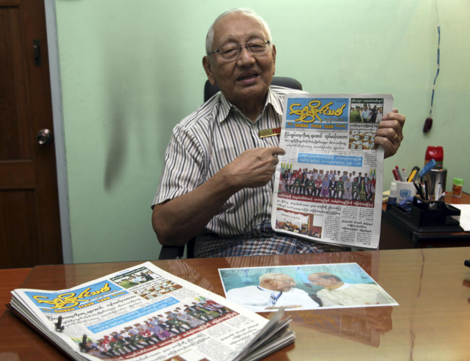 In this photo taken on March 11, 2014, Khin Maung Lay, chief editor of “The Golden Fresh Land Daily” newspaper, shows their newspaper as he talks during an interview in Yangon, Myanmar. “It breaks my heart,” said Khin Maung Lay, who has been part of the country's ever-shifting media landscape for most of his 82 years and was jailed repeatedly when it was under military rule. “Today is my real last day as a newsman.” Khin Maung Lay's paper published its last edition Wednesday, March 12. (AP Photo/Khin Maung Win)