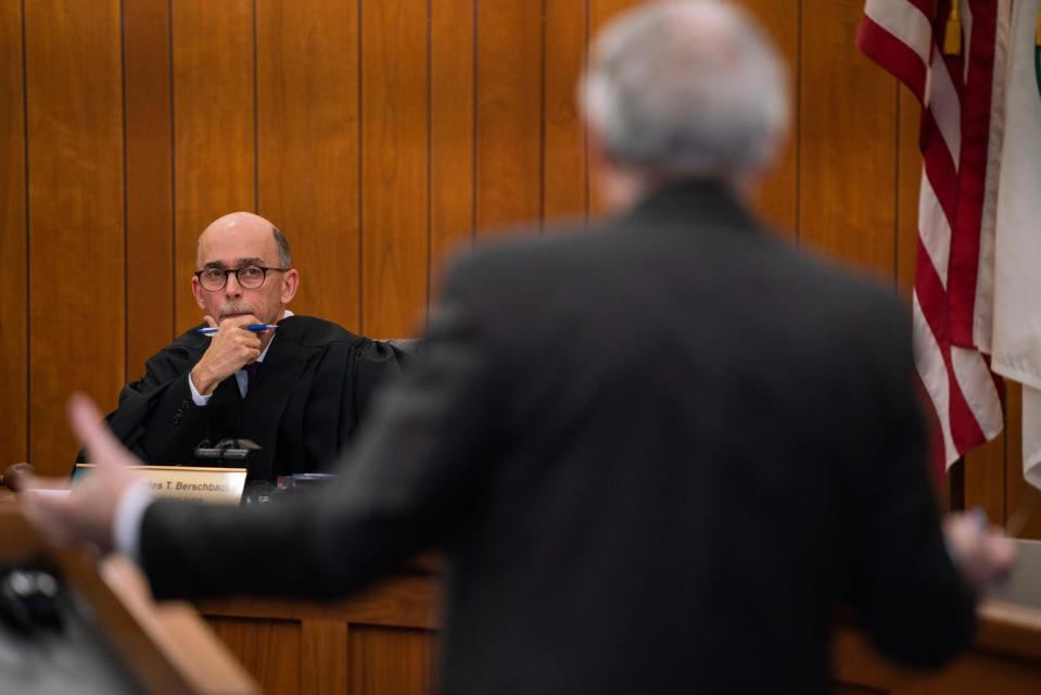 Municipal Judge Charles Berschback, left, listens as attorney James Joseph Sullivan, right, defends his client David Sutherland, an attorney who has been charged with embezzling hundreds of thousands of dollars from recently deceased Carhartt heiress Gretchen Valade's trust, during an arraignment hearing at Grosse Pointe Farms Municipal Court on Jan. 11, 2023.
