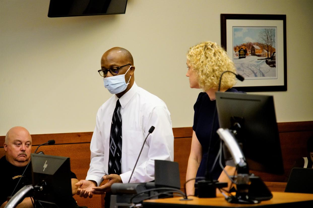 Former Columbus City Schools' Northland High School teacher Robert Pea, 62, center, apologized Thursday, Oct. 5, 2023, during his sentencing hearing in Franklin County Common Pleas Court for arranging to pay a 16-year-old girl for sex in 2021. He was sentenced by Common Pleas Judge Bill Sperlazza to five years of probation for promoting prostitution.