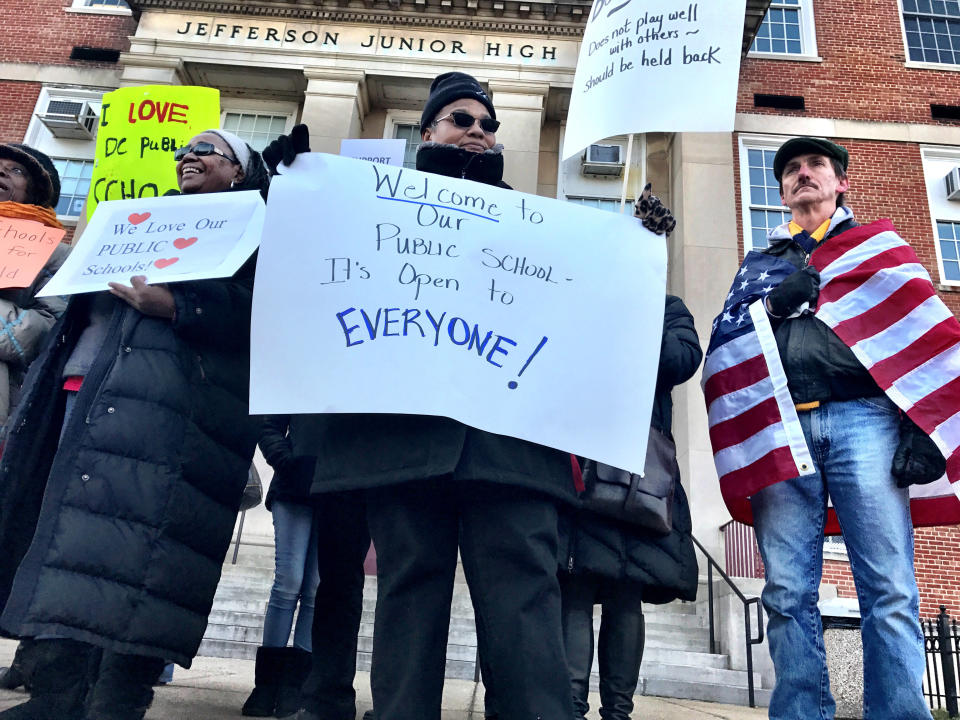 Demonstrators last February wait for the arrival of DeVos at Jefferson Middle School Academy. (Photo: The Washington Post via Getty Images)