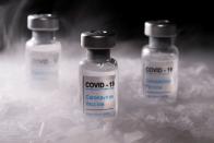 FILE PHOTO: Vials labelled "COVID-19 Coronavirus Vaccine" are placed on dry ice in this illustration