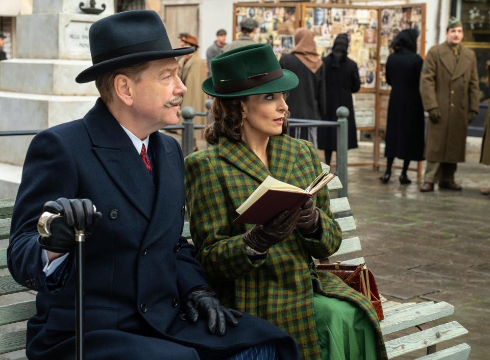 Hercule Poirot (Kenneth Branagh, left) accompanies Ariadne Oliver (Tina Fey) to a Halloween party in "A Haunting in Venice."