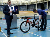 UCI Technical Manager Mark Barfield (L) gives details on the magnetic resonance technology used to detect a bike equipped with a motor during a media event at the Union Cycliste Internationale (UCI) in Aigle, Switzerland May 3, 2016. REUTERS/Denis Balibouse