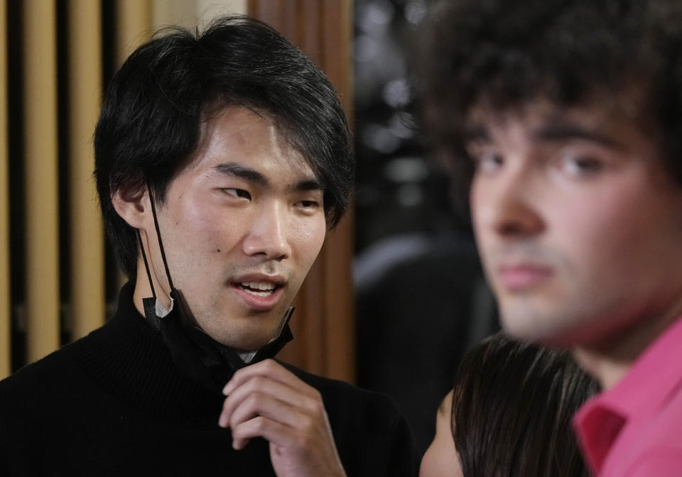 Pianist Bruce (Xiaoyu) Liu, left, of Canada reacts after being named as the winner of the 40,000-euro ($45,000) first prize in the 18th Frederic Chopin international piano competition, a prestigious event that launches pianists’ world careers. Almost 90 pianists from around the globe took part in the 18th edition of the competition that was postponed from 2020 due to the pandemic. (AP Photo/Czarek Sokolowski)