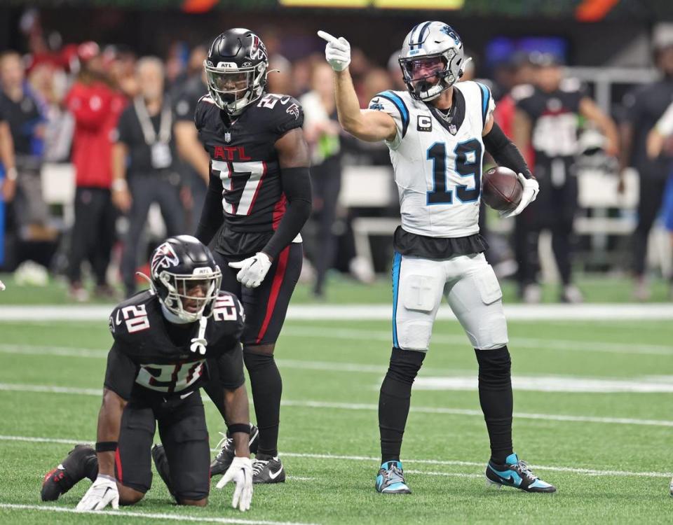 Carolina Panthers wide receiver Adam Thielen, right, signals first down following a pass reception from quarterback Bryce Young during fourth-quarter action against the Atlanta Falcons at Mercedes-Benz Stadium in Atlanta, GA on Sunday, September 10, 2023. The Falcons defeated the Panthers 24-10.