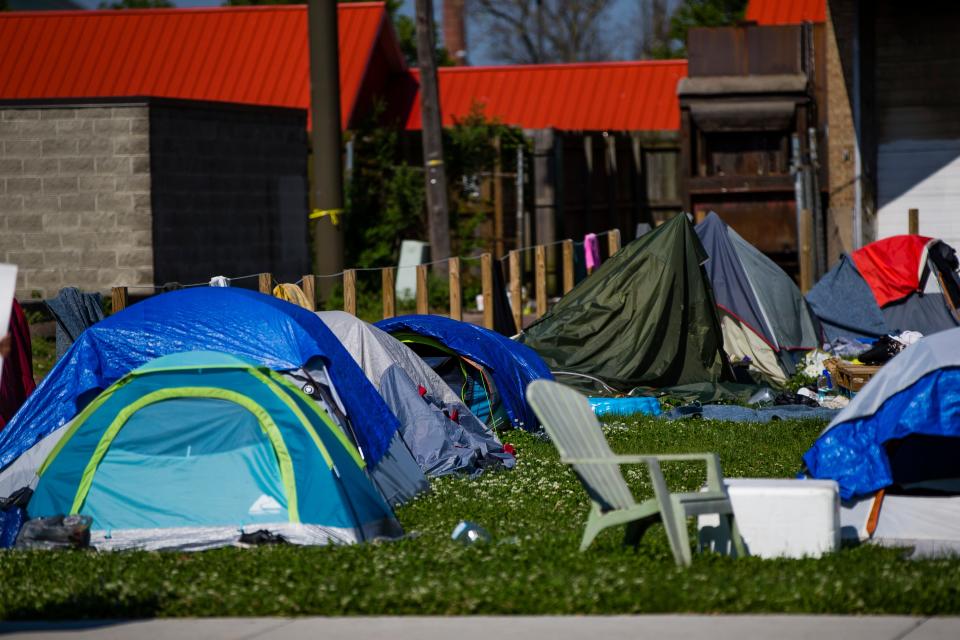Tents are setup Tuesday, May 26, 2020, at the homeless encampment on Michigan Street in South Bend.