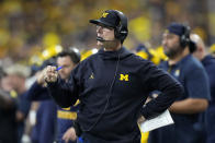 Michigan head coach Jim Harbaugh watches from the sideline during the first half of the Big Ten championship NCAA college football game against Iowa, Saturday, Dec. 4, 2021, in Indianapolis. (AP Photo/AJ Mast)