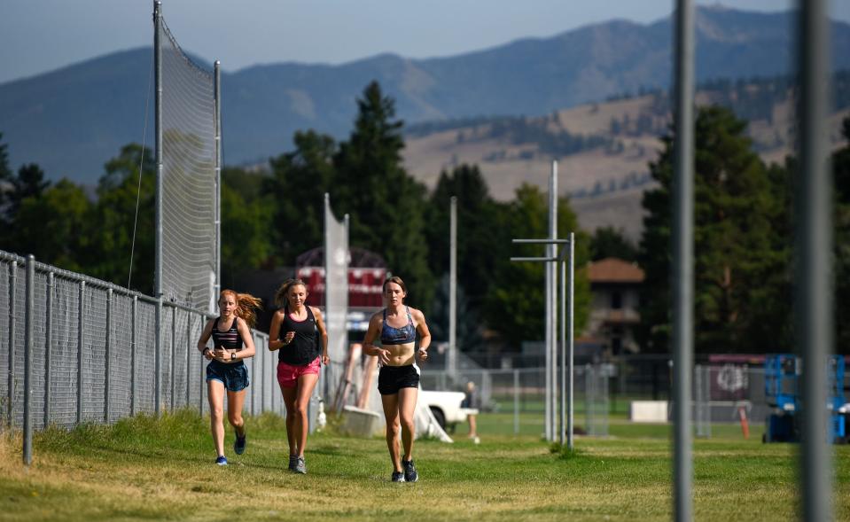 June Eastwood, right, competed for the University of Montana's men's track and cross country teams from 2016 to 2018 before transitioning.