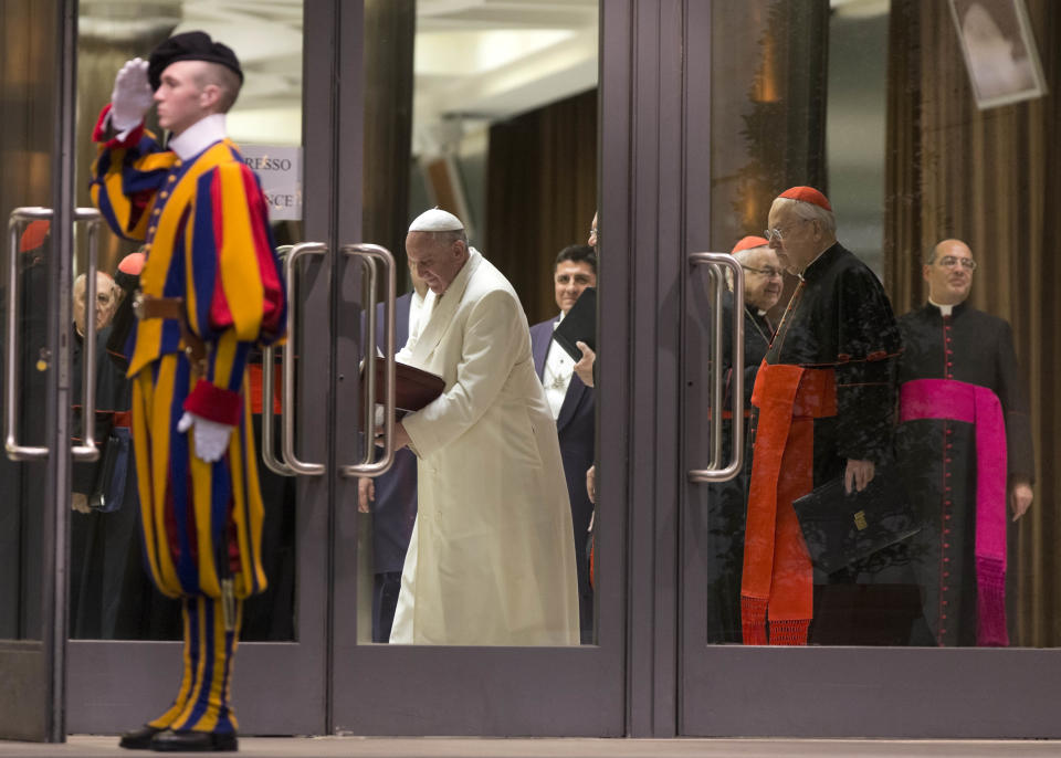 Pope Francis leaves at the end of the afternoon session of an extraordinary consistory in the Synod hall at the Vatican City, Thursday, Feb. 20, 2014. Cardinals from around the globe have begun discussing some of the most contentious issues in the church amid findings from Vatican-mandated surveys that most Catholics reject church teaching on contraception, divorce and homosexuality. Pope Francis opened the two-day meeting Thursday by urging his cardinals to find "intelligent, courageous" ways to help families under threat today without delving into case-by-case options to get around Catholic doctrine. (AP Photo/Alessandra Tarantino)