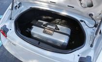 <p>The Miata's trunk is-surprise!-small. But it's not <em>that </em>small, even if its opening is an oddball trapezoid shape. So, unless you travel with Imelda Marcos, you and a companion could feasibly stuff a weekend's worth of luggage in the Miata's five-cubic-foot trunk. </p>