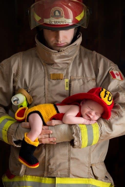 Halifax firefighter Billy Marr, who has cancer, is shown holding his newborn son Brody in January 2016.