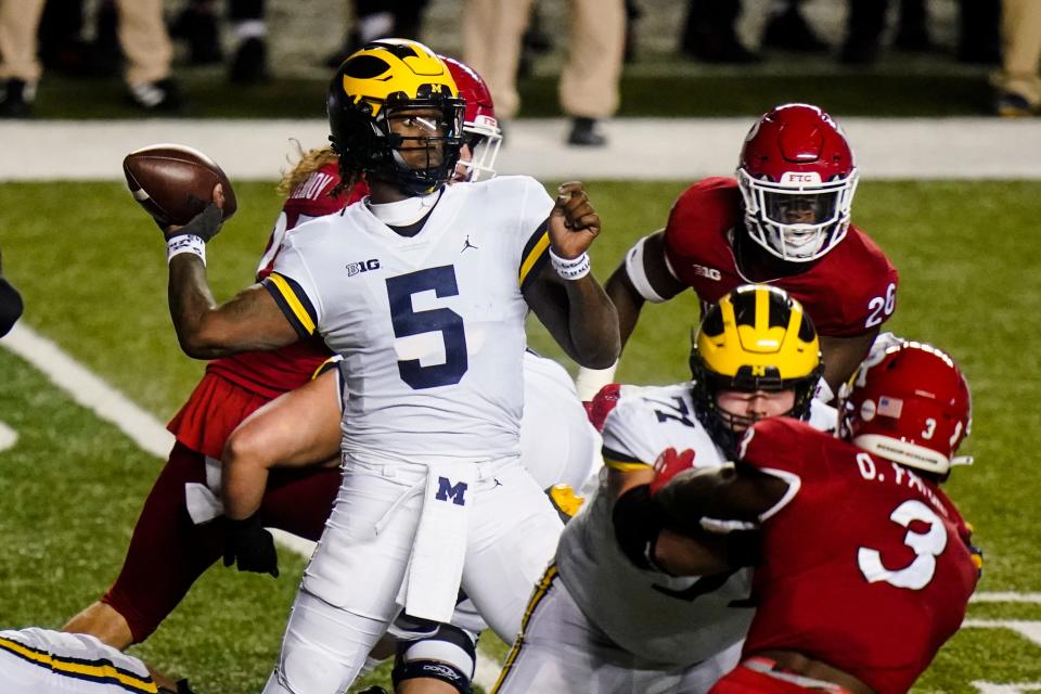 Michigan quarterback Joe Milton (5) throws a pass during the first half of the team's NCAA college football game against Rutgers on Saturday, Nov. 21, 2020, in Piscataway, N.J.