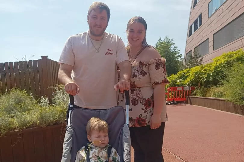 Enzo with his mum, Amy, and dad, Lee