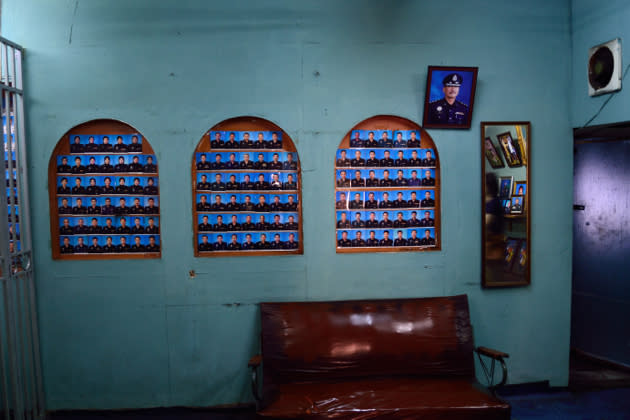 But, there is little of the usual photo business and the photographer, known simply as Mr Lau, relies on his regular clientele: the police force. He displays hundreds of mugshots of police officers at the shop.