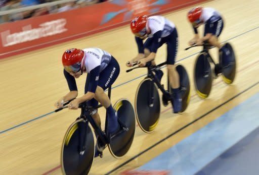 Britain's Dani King, Laura Trott and Joanna Rowsell compete to set a new world record during the London 2012 Olympic Games women's team pursuit first round track cycling event at the Veldorome in the Olympic Park in East London on August 4, 2012