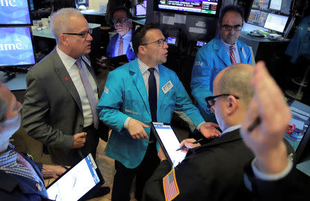 Traders work on the floor at the New York Stock Exchange (NYSE) in New York, U.S., April 18, 2019. REUTERS/Brendan McDermid