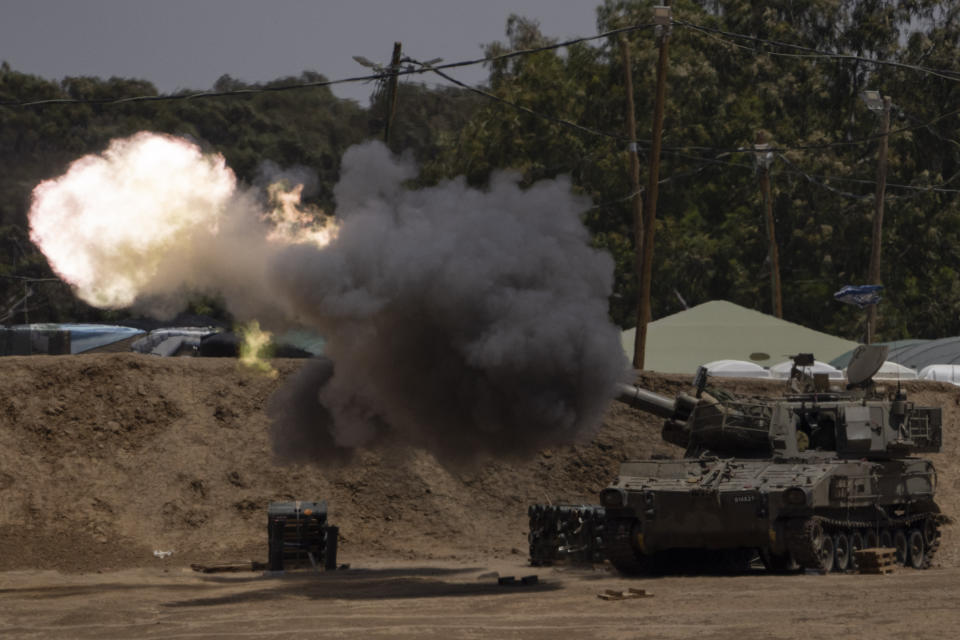 An Israeli mobile artillery unit fires a shell from southern Israel towards the Gaza Strip, in a position near the Israel-Gaza border, Monday, May 13, 2024. (AP Photo/Leo Correa)