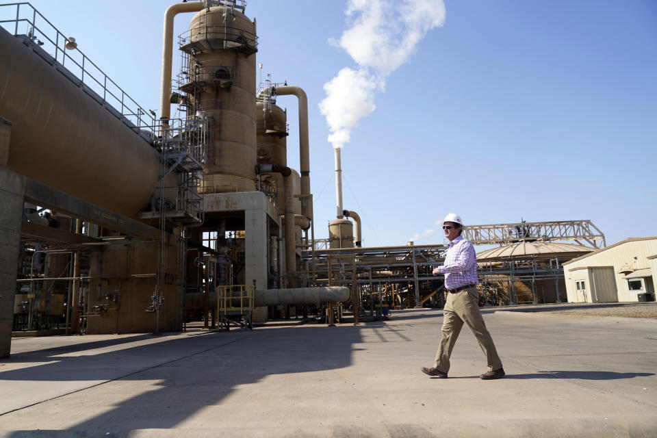 Derek Benson, chief operating officer of EnergySource Minerals, walks on the Featherstone plant in Calipatria, Calif., where the company is producing geothermal energy and mining for lithium Friday, July 16, 2021. Benson says EnergySource Minerals has extracted lithium there on a small scale since 2016 and the company has plans to build a much larger addition for mineral extraction. (AP Photo/Marcio Jose Sanchez)