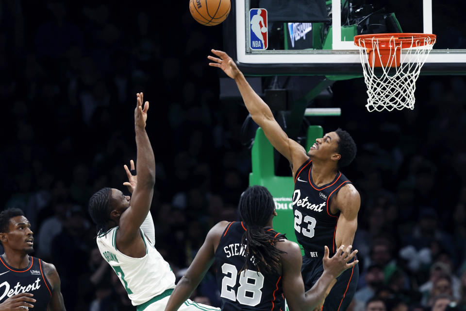 Boston Celtics' Jaylen Brown (7) shoots against Detroit Pistons' Jaden Ivey (23) during the first half of an NBA basketball game, Monday, March 18, 2024, in Boston. (AP Photo/Michael Dwyer)