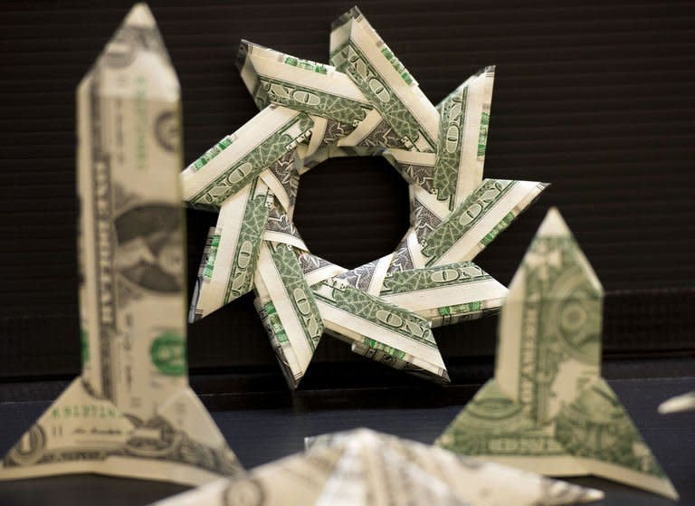 Origami made from dollar bills on display at the Origami Convention 2013 at the Fashion Institute of technology in New York on June 22, 2013. Hundreds of enthusiasts gathered in New York over the weekend for a convention celebrating origami, the ancient Asian art of paper folding, as the craft gains increasing recognition as serious art in the West