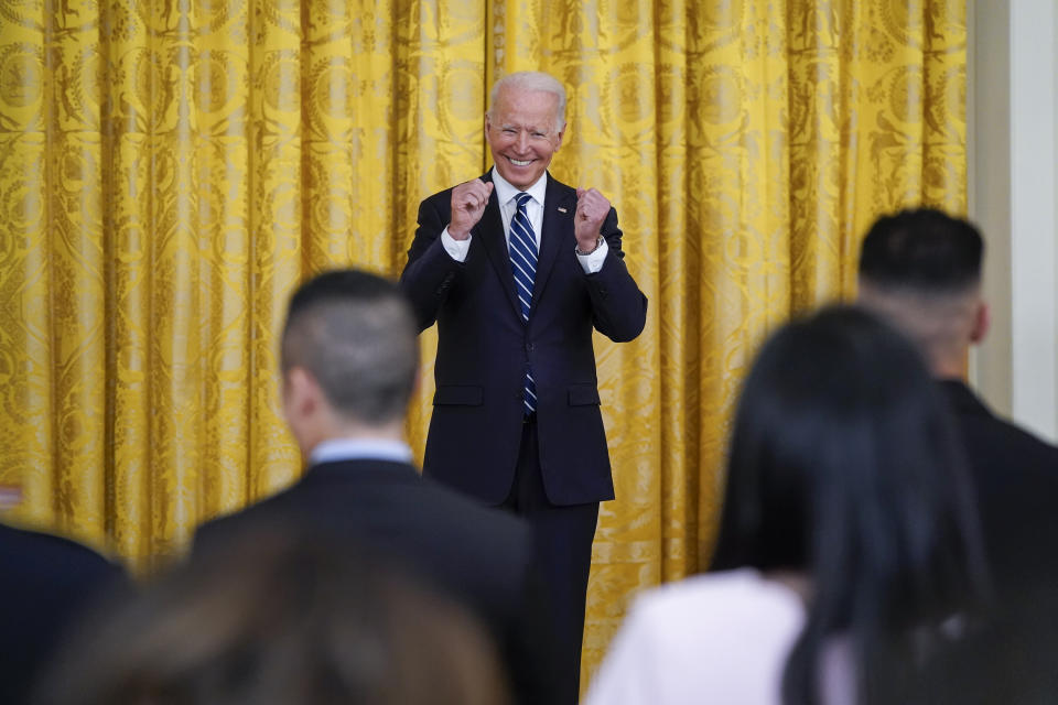 President Joe Biden smiles after people took the Oath of Allegiance during a naturalization ceremony in the East Room of the White House, Friday, July 2, 2021, in Washington. (AP Photo/Patrick Semansky)