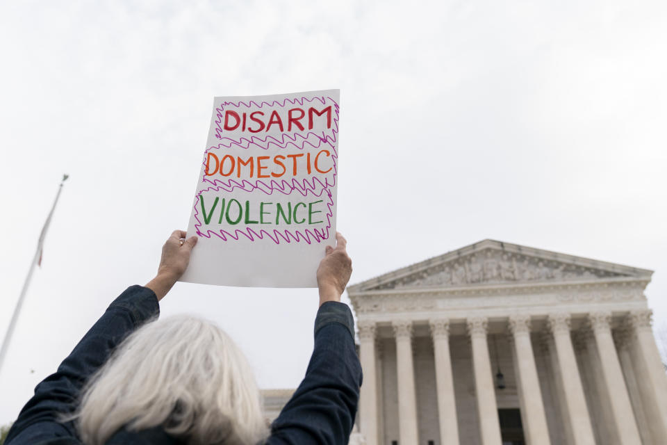 Gun safety and domestic violence prevention organizations gather outside of the Supreme Court before oral arguments are heard in United States v. Rahimi, Tuesday, Nov. 7, 2023, in Washington. (AP Photo/Stephanie Scarbrough)