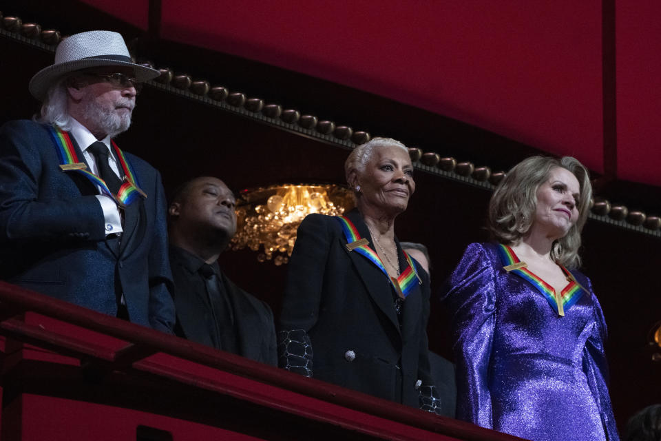 2023 Kennedy Center Honorees, from left, British singer and member of the Bee Gees, Barry Gibb, singer Dionne Warwick, and soprano Renée Fleming attend the 46th Kennedy Center Honors at the John F. Kennedy Center for the Performing Arts in Washington, Sunday, Dec. 3, 2023. (AP Photo/Manuel Balce Ceneta)