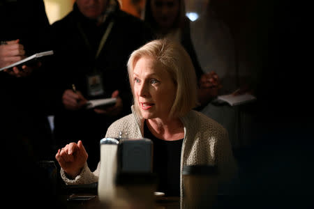 FILE PHOTO: U.S. Senator Kirsten Gillibrand (D-NY) talks to customers at the Pierce Street Coffee Works while on a walking tour after announcing that she is forming an exploratory committee to enter the 2020 presidential race, in Sioux City, Iowa, U.S., January 18, 2019. REUTERS/Scott Morgan/File Photo