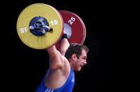 LONDON, ENGLAND - DECEMBER 11: Kevin Bouly of France makes a lift in the Men's 105kg during the Weightlifting LOCOG Test Event for London 2012 at ExCel on December 11, 2011 in London, England. (Photo by Julian Finney/Getty Images)