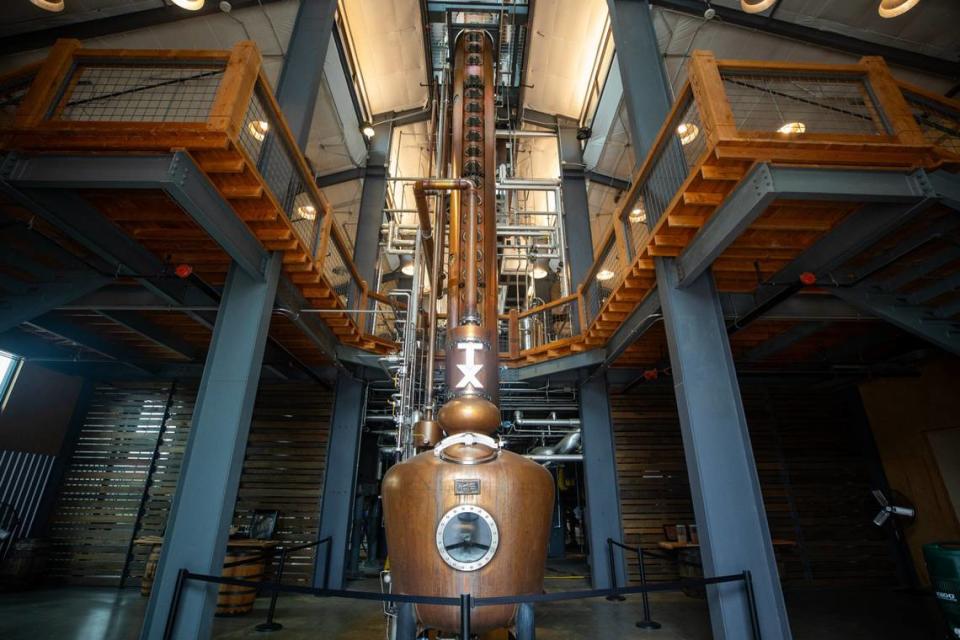 A copper doubler sits inside a warehouse at TX Whisky Ranch in Fort Worth Texas on Tuesday, June 11, 2024. A 50 feet 36 inch column starts the first part of distillation, then moves on to a 500 gallon copper doubler for the second part of the distillation process.