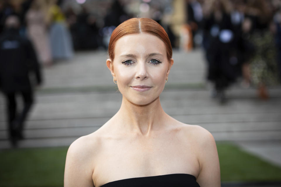 Stacey Dooley poses for photographers upon arrival at the Olivier Awards in London, Sunday, April 10, 2022. (Photo by Vianney Le Caer/Invision/AP)