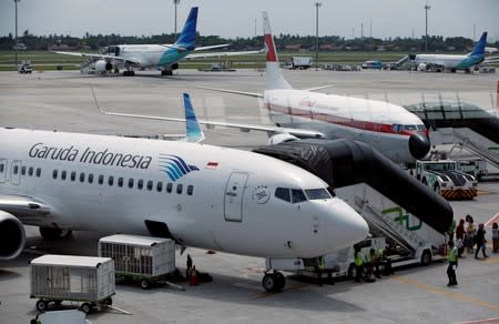 FILE PHOTO: Garuda Indonesia planes are seen on the tarmac of Terminal 3 at Soekarno Hatta International Airport near Jakarta,