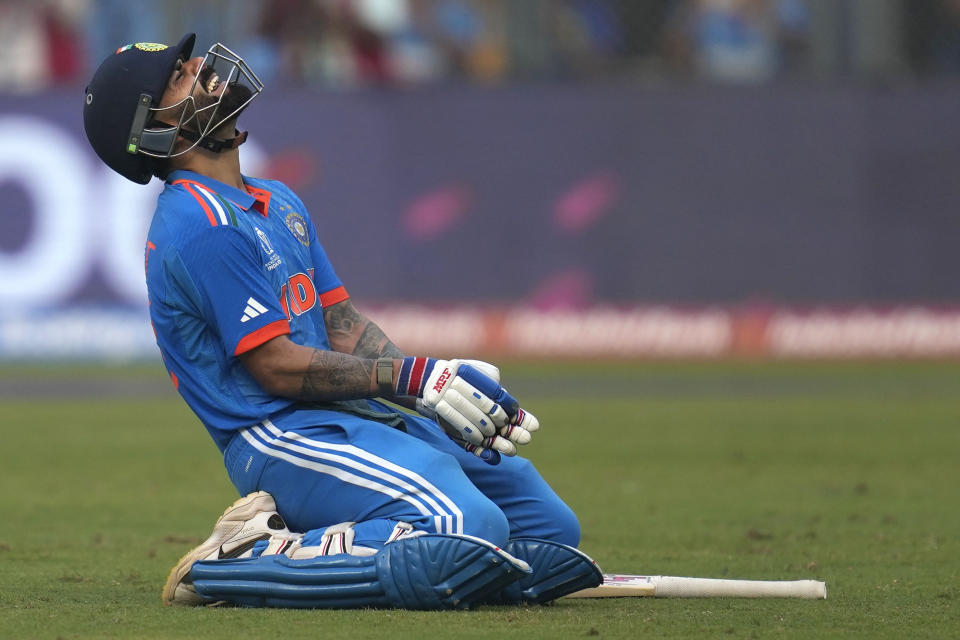 India's Virat Kohli celebrates his century during the ICC Men's Cricket World Cup first semifinal match between India and New Zealand in Mumbai, India, Wednesday, Nov. 15, 2023. (AP Photo/Rafiq Maqbool)