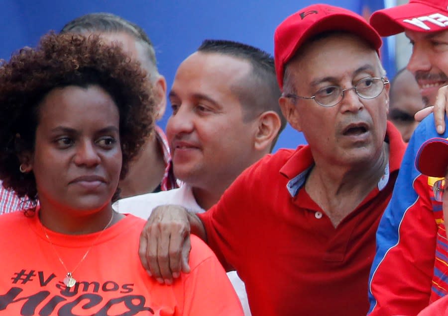 FILE – Luis Alfredo Motta Dominguez, right, attends a pro-government rally in Caracas, Venezuela, on April 6, 2019. A secret memo obtained by The Associated Press details a covert operation by the U.S. Drug Enforcement Administration that sent undercover operatives into Venezuela to record and build drug-trafficking cases against the country’s leadership including Dominguez. (AP Photo/Ariana Cubillos, File)