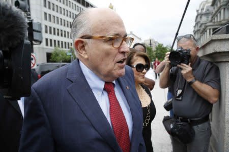 President Donald Trump's attorney Rudy Giuliani arrives with his guest Jennifer Leblanc at the White House in Washington, U.S., May 30, 2018. REUTERS/Joshua Roberts