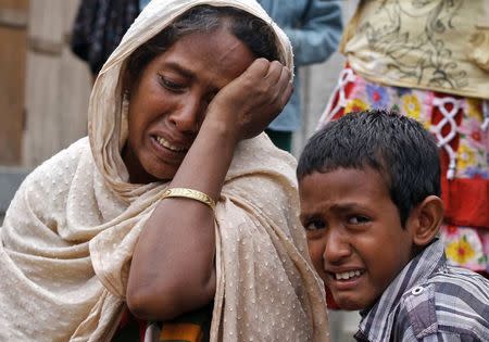 Villagers from Muslim communities affected by ethnic violence weep at a relief camp in Narayanguri village in Baksa district in Assam May 4, 2014. REUTERS/Utpal Baruah