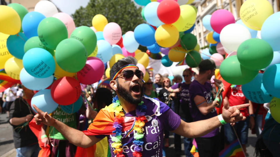 Participants take part in the annual Pride London Parade, in London