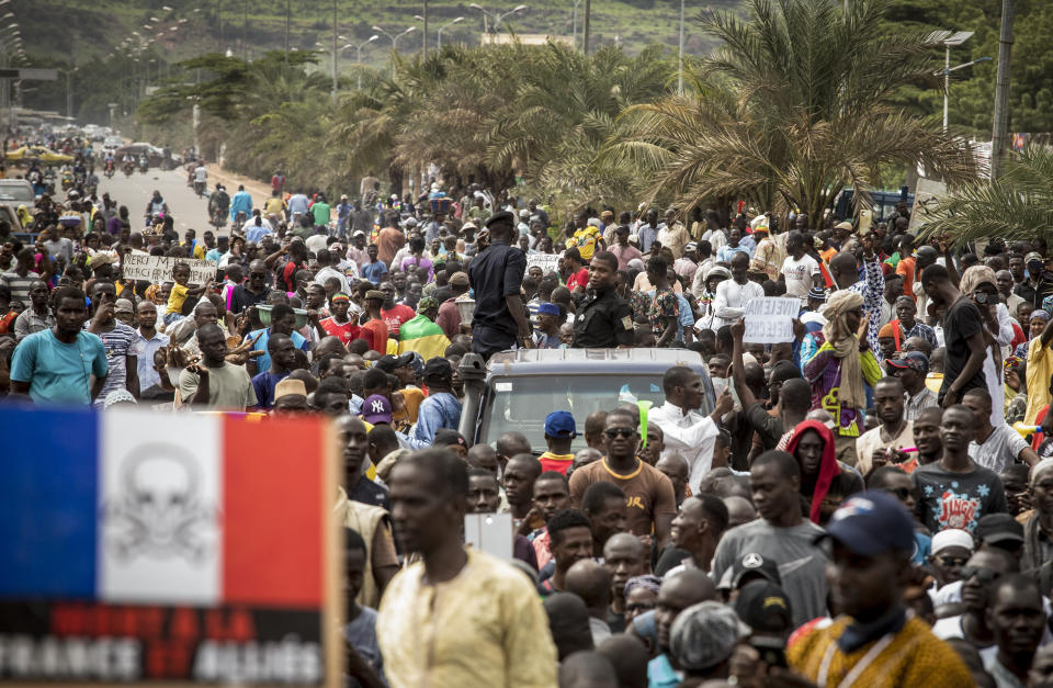 Malians supporting the recent overthrow of President Ibrahim Boubacar Keita gather to celebrate in the capital Bamako, Mali Friday, Aug. 21, 2020. Hundreds marched in the streets of Mali's capital Friday to celebrate the overthrow of Keita, as the West African country's longtime political opposition backed the military's junta plan to eventually hand over power to a civilian transitional government. (AP Photo)